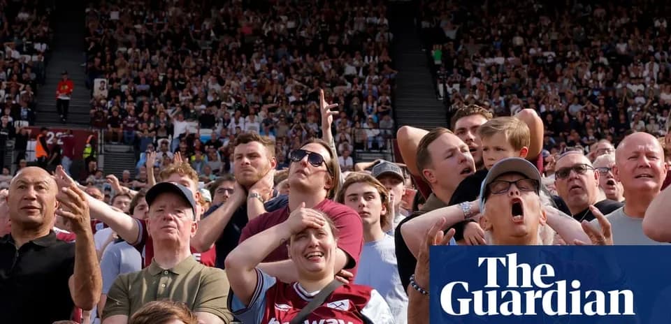 Crowd reacting during a football match in stadium