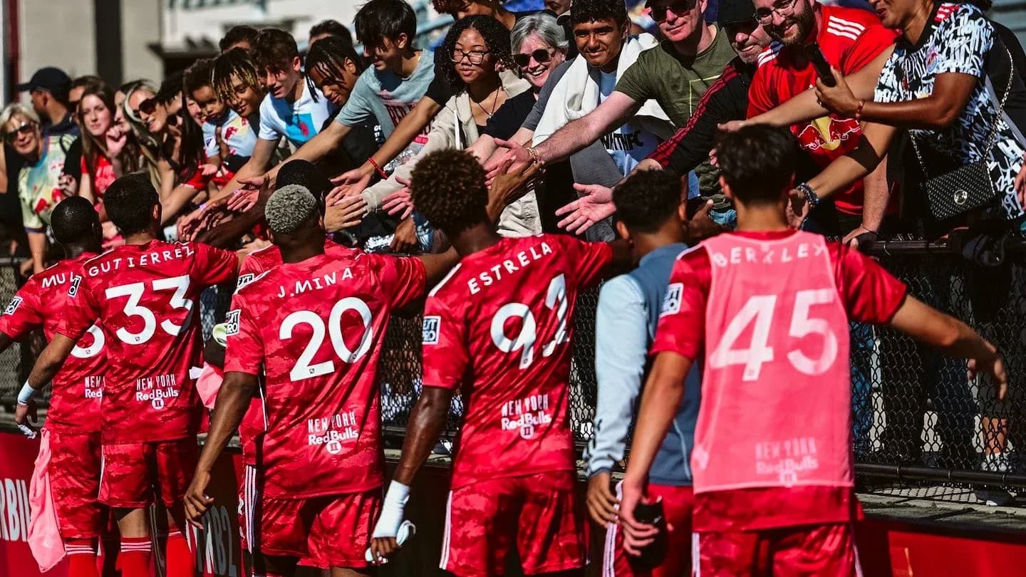 New York Red Bulls players celebrating with fans