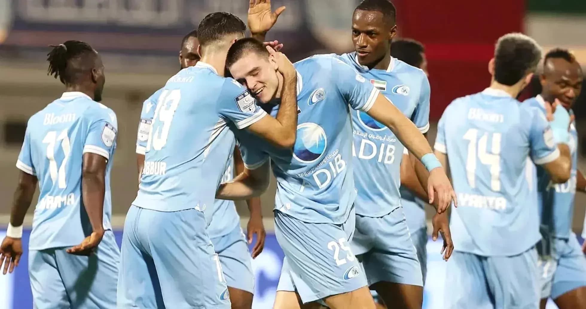 Players celebrating a goal during match