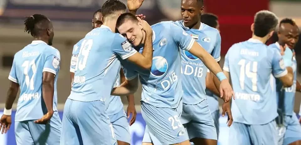 Players celebrating a goal during match