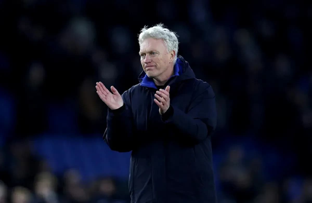 Manager applauding fans after the match