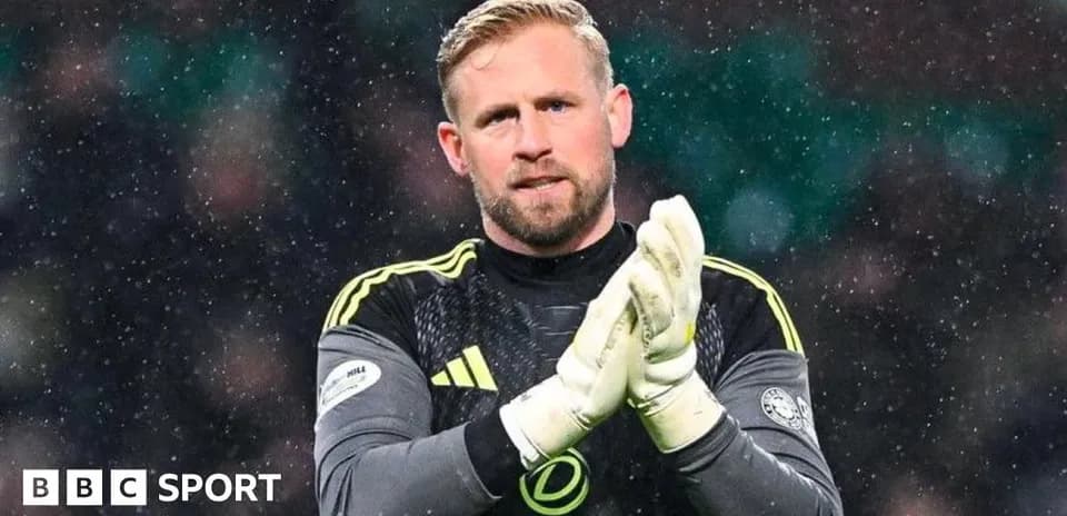 Goalkeeper clapping in snowy match conditions