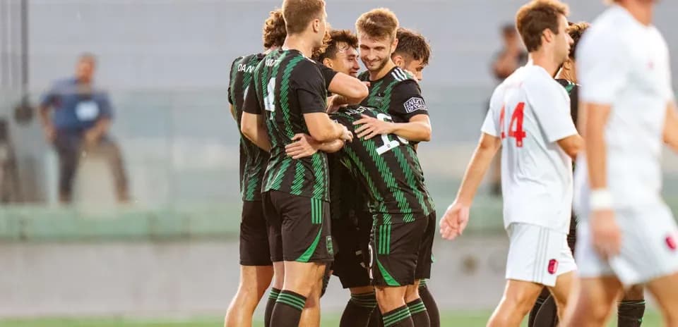 Players celebrating a goal during MLS Next Pro match