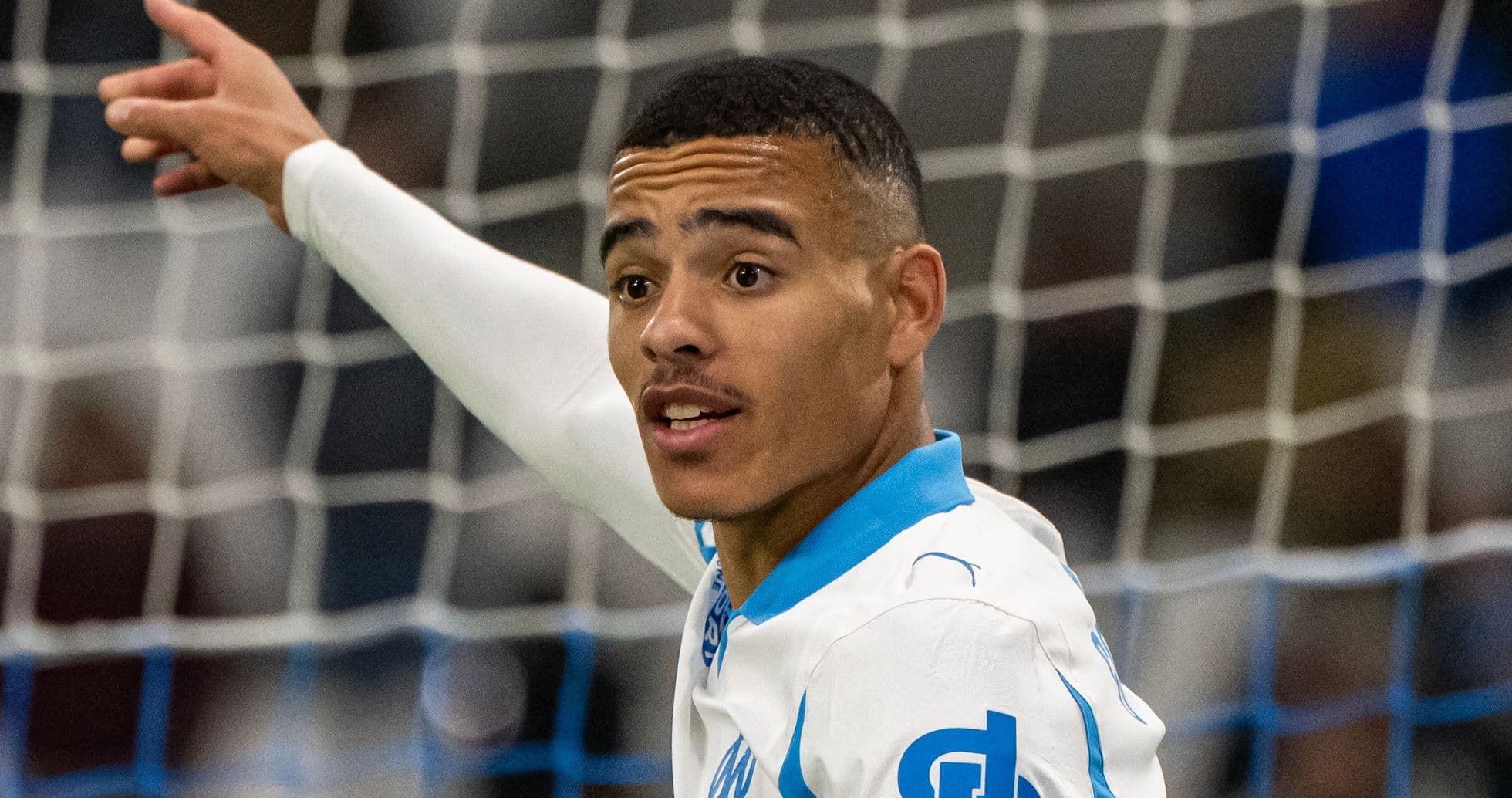 Player celebrating a goal on the pitch
