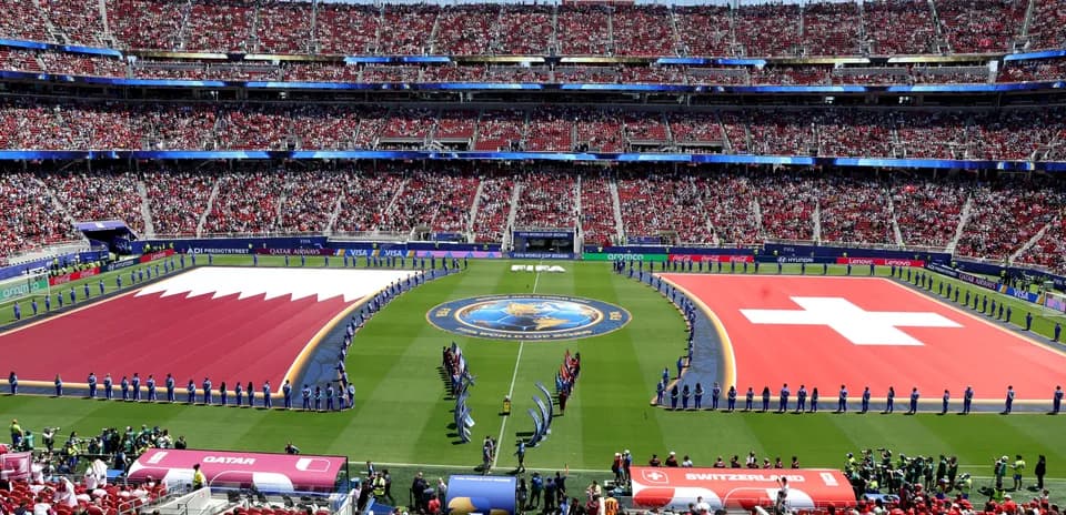 Qatar and Switzerland flags displayed at stadium