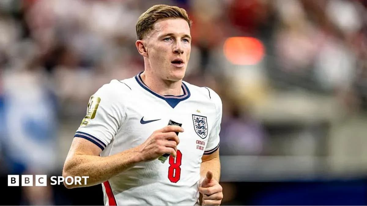 Player running on field in England jersey