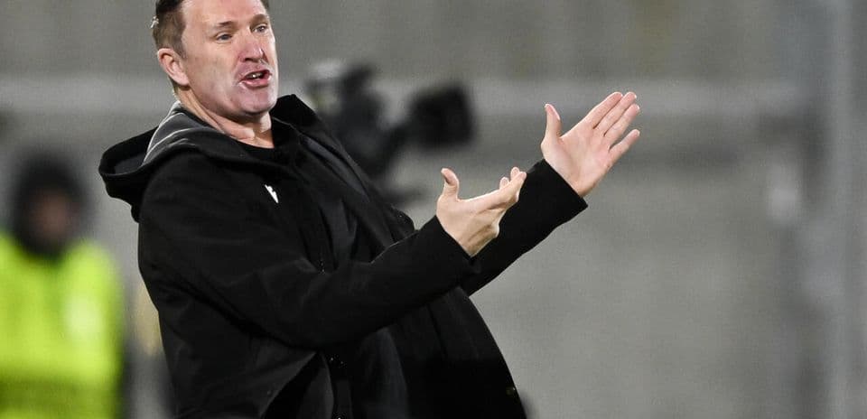 Coach gesturing during match from the sideline