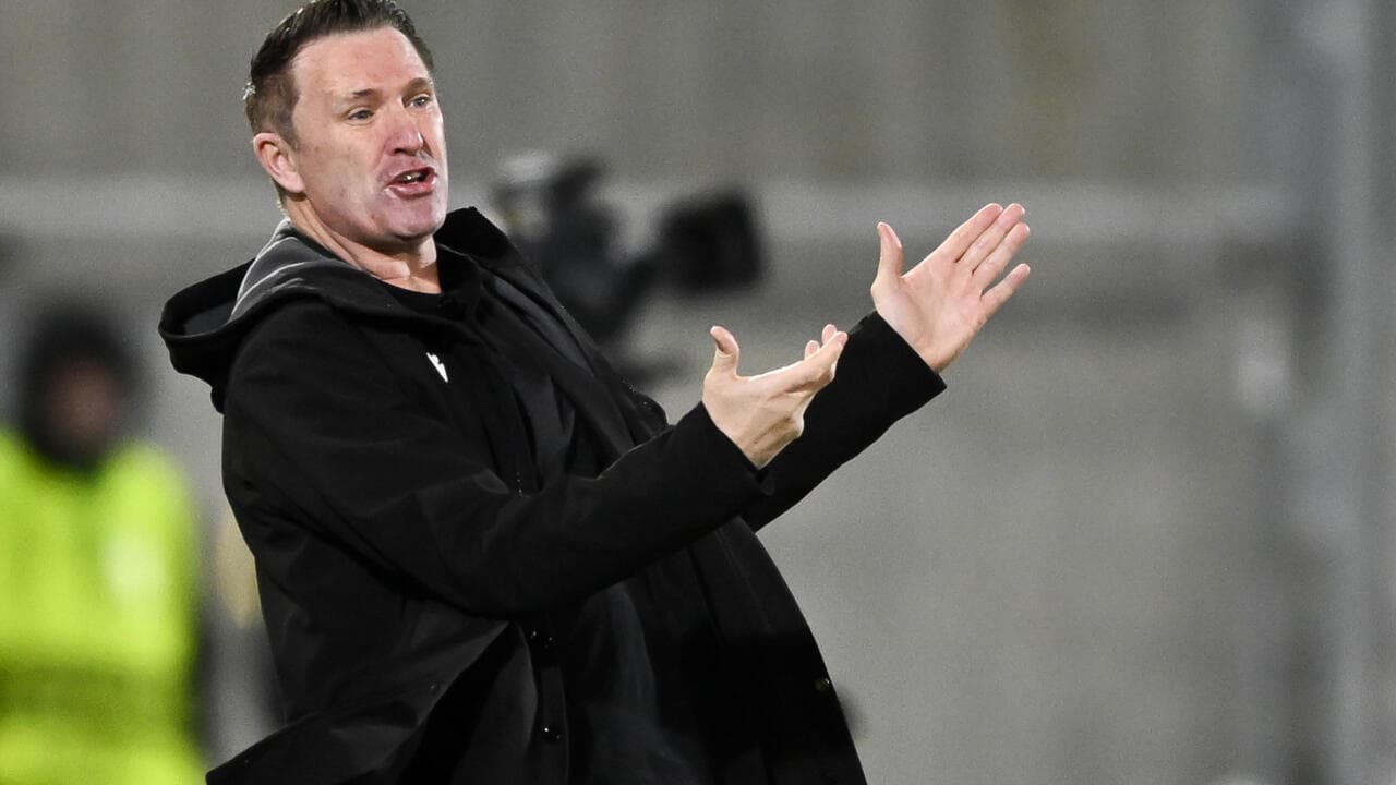 Coach gesturing during match from the sideline
