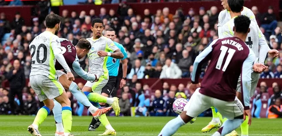 Manchester City player taking a shot on goal