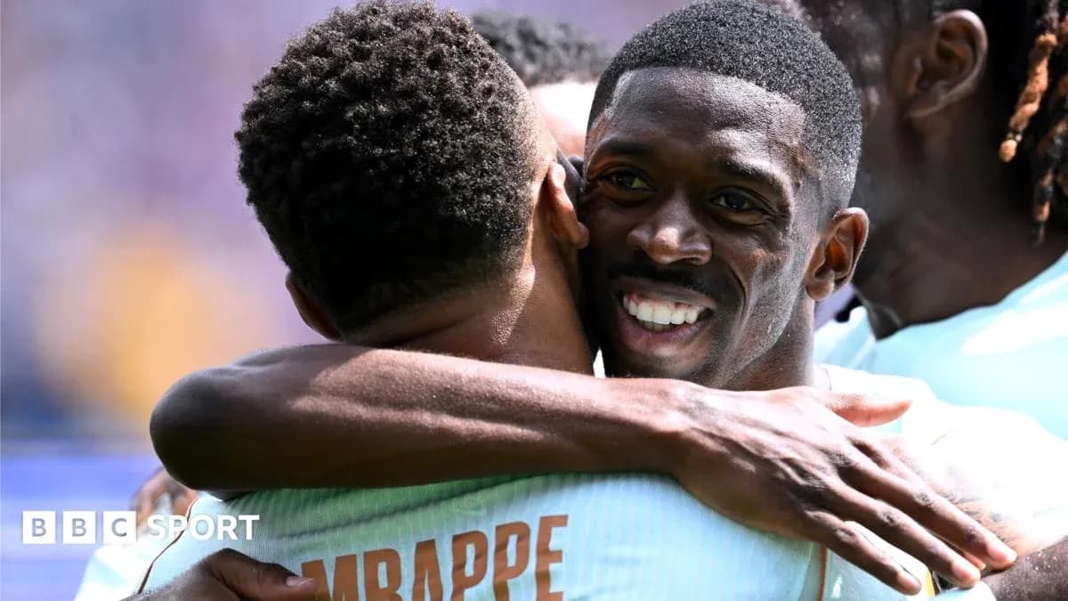 Players celebrating with an embrace after a goal