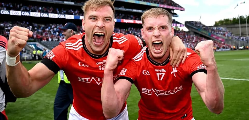 Two players celebrating victory on the pitch