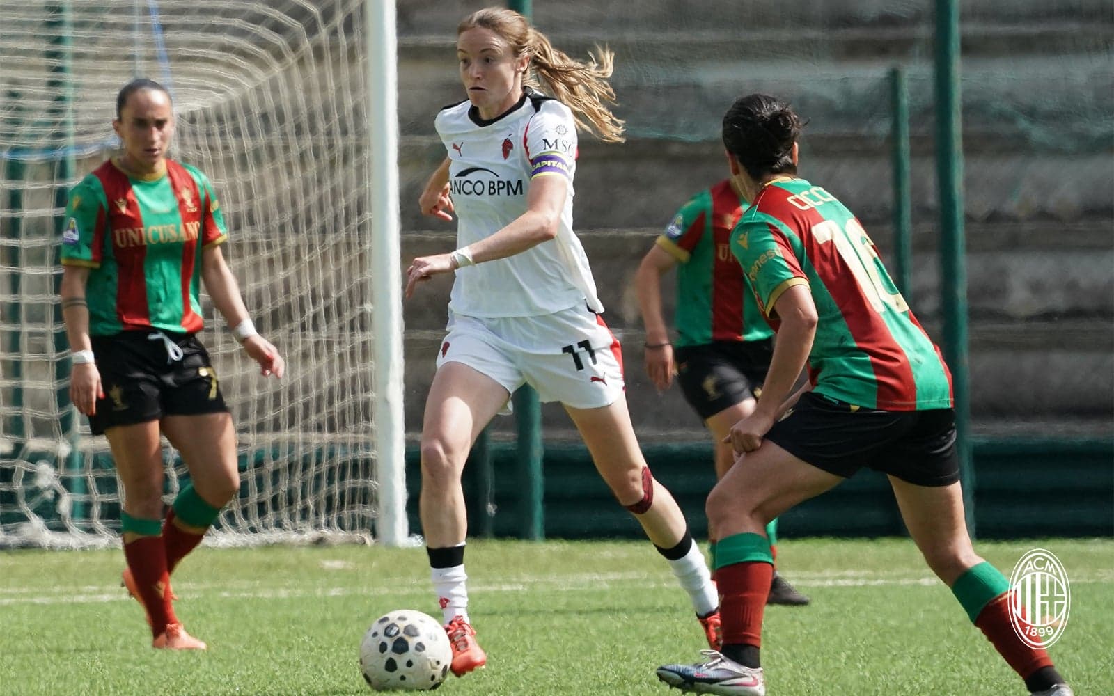 Female players competing for the ball in Serie A match Female players competing for the ball in Serie A match