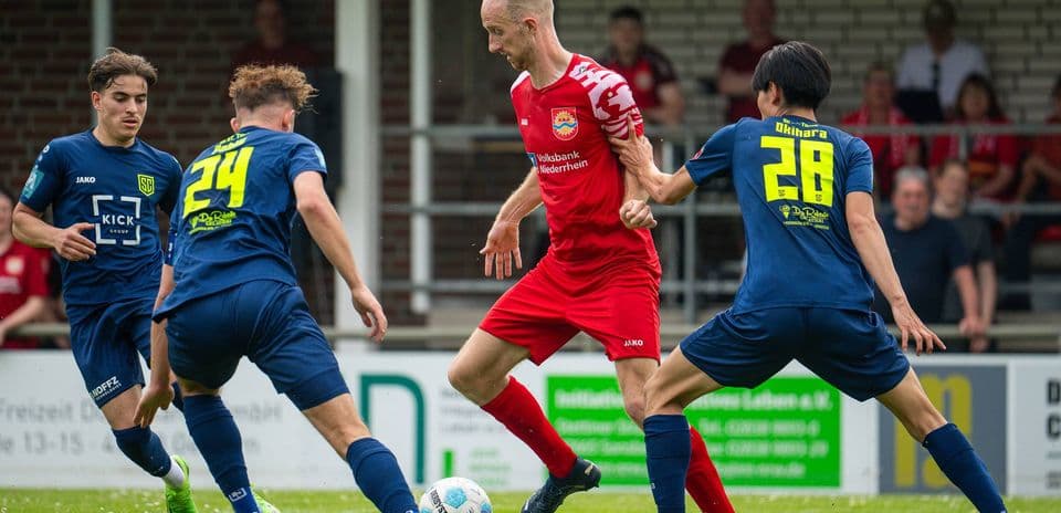 Players competing for the ball during match