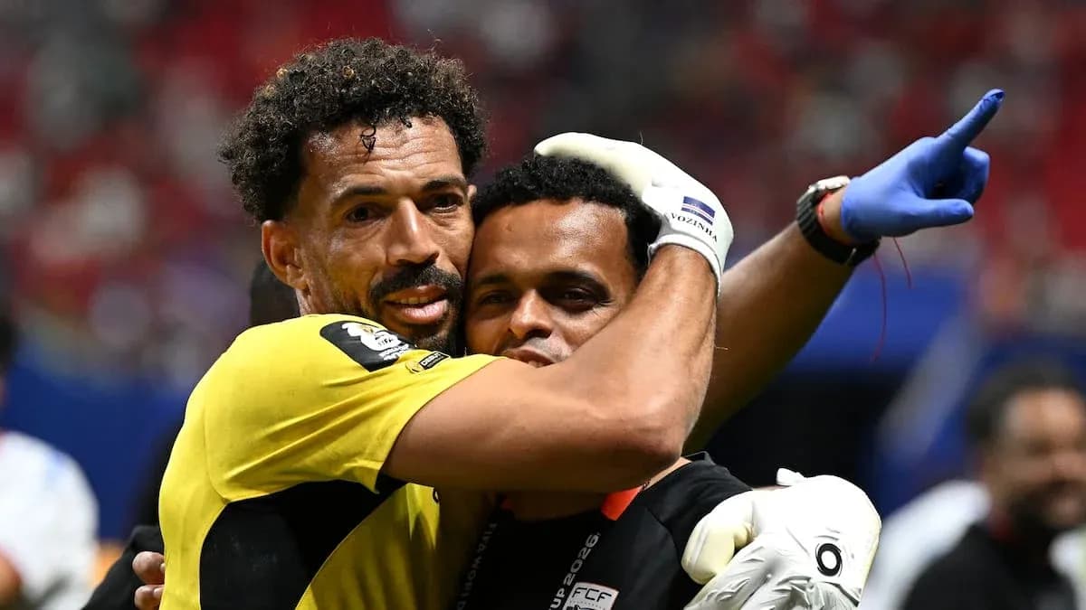 Goalkeeper embracing teammate after match victory