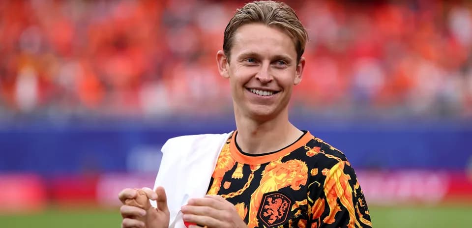Player smiling in vibrant team jersey on field