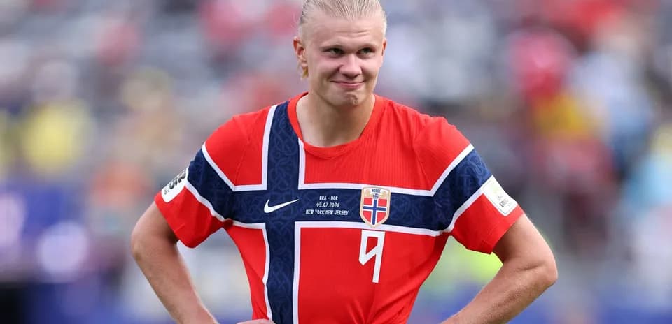 Norway player in red jersey on field