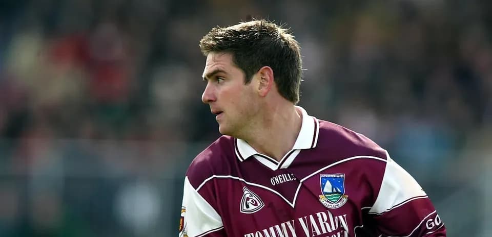 Player in maroon jersey during a match