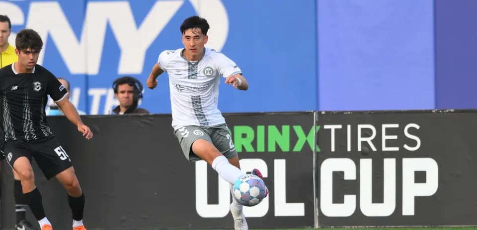 Player dribbling the ball during USL Cup match