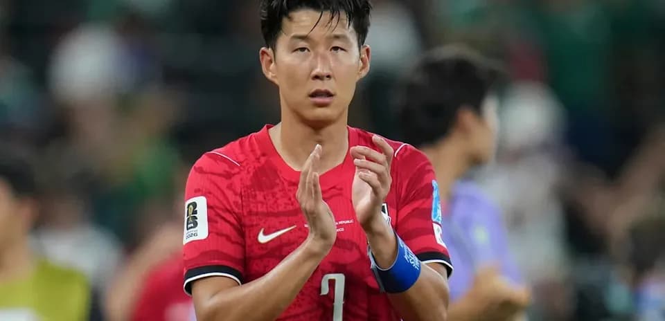 Player applauding fans after a match