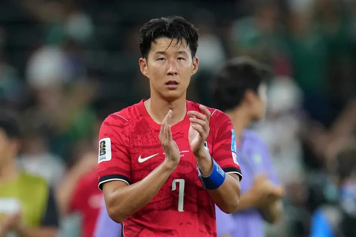Player applauding fans after a match