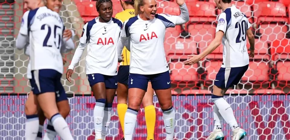 Tottenham players celebrating a goal in match