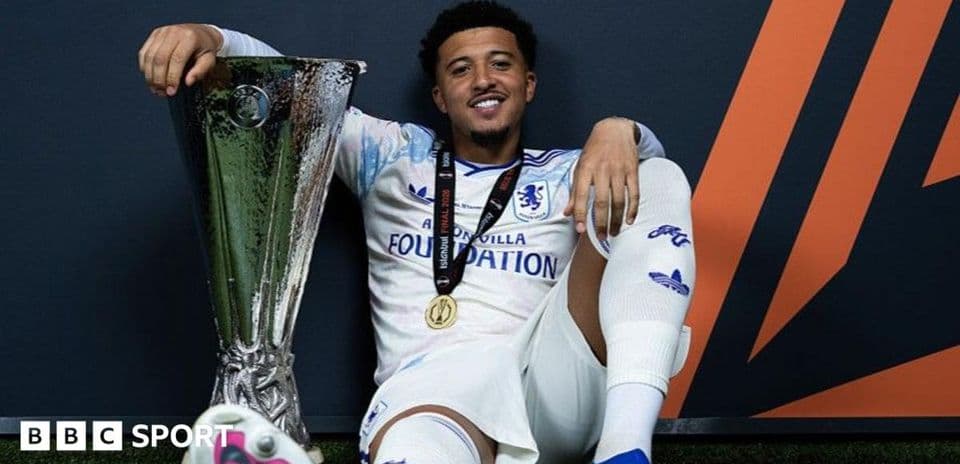 Player posing with trophy after winning final