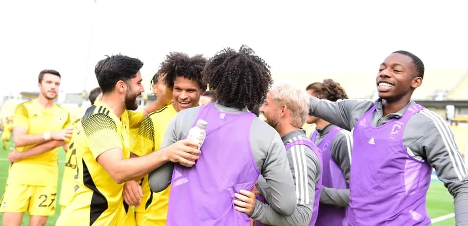 Columbus Crew II players celebrating after match