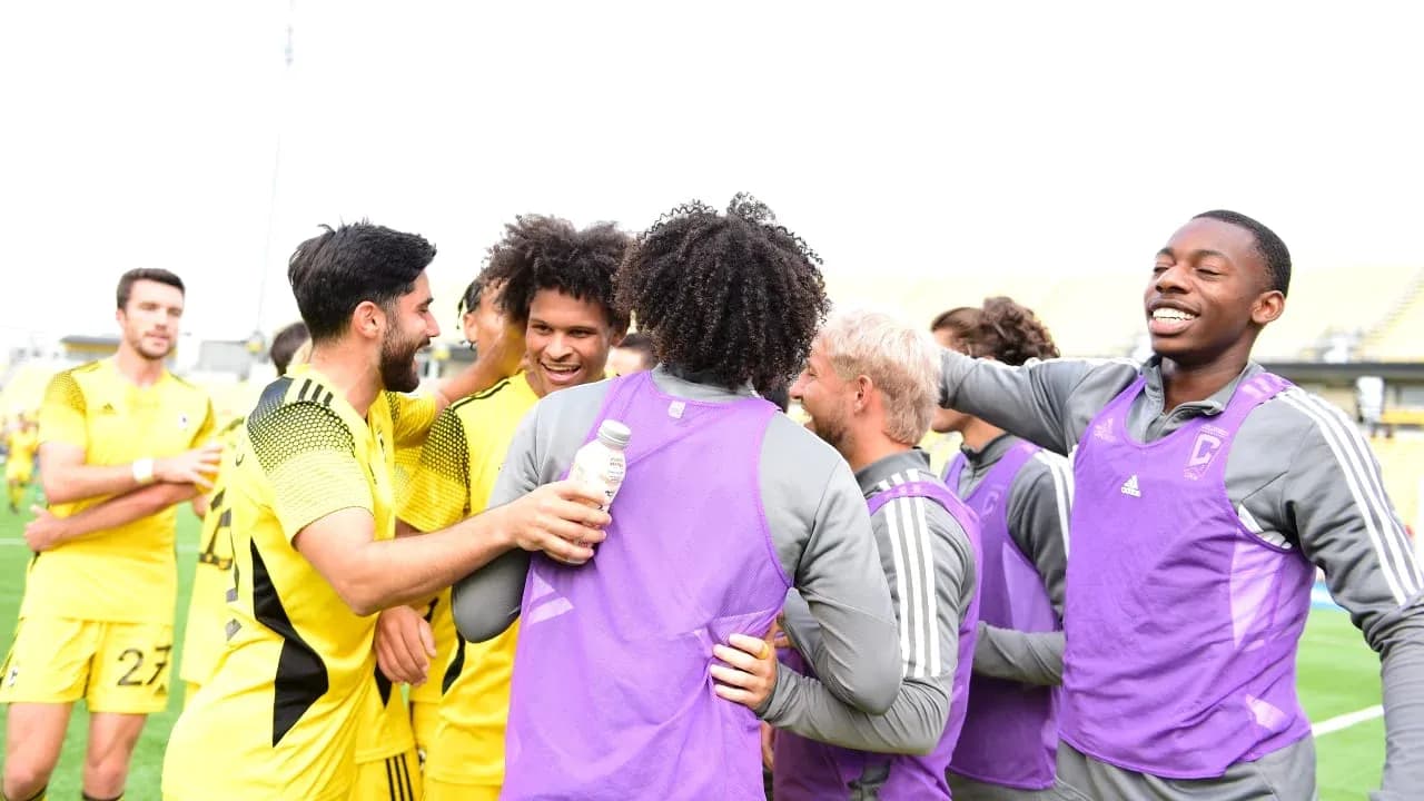 Columbus Crew II players celebrating after match