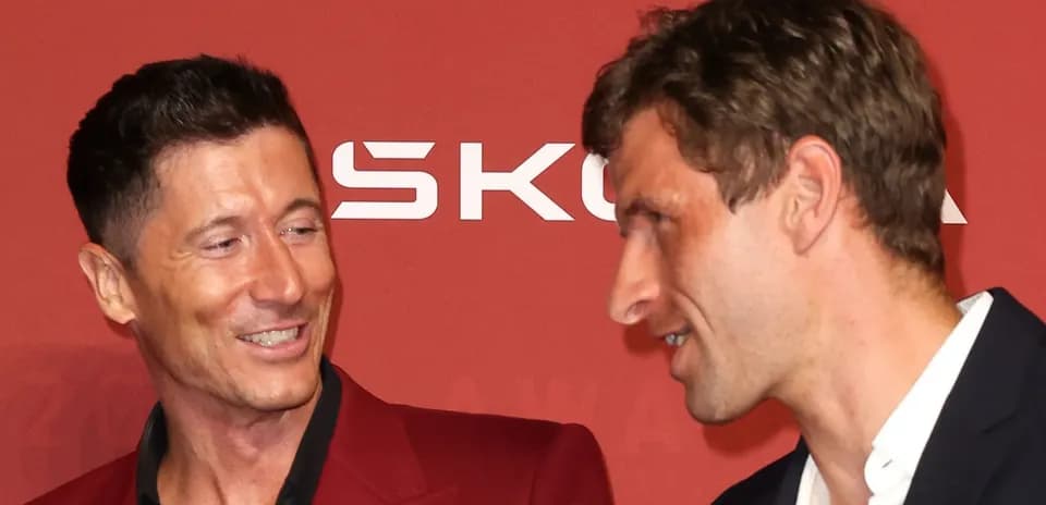 Two men interacting at an awards ceremony