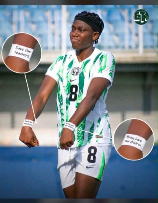 Football player wearing wristbands with messages