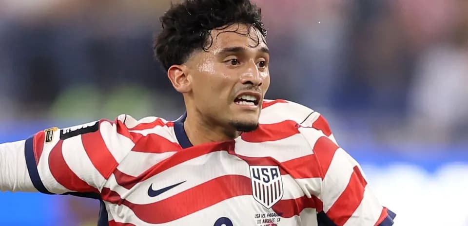 Player wearing USA jersey during soccer match