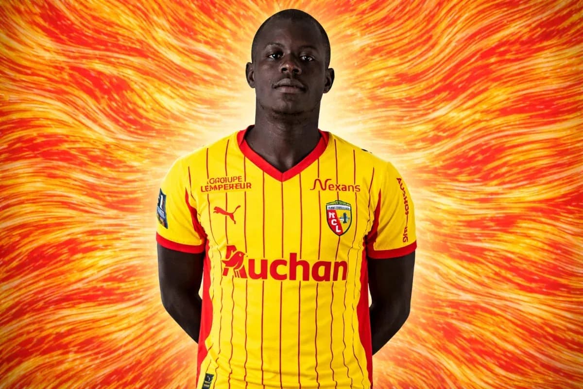 Player in yellow and red jersey with logo