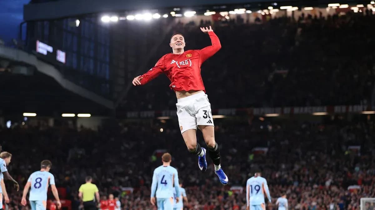 Player celebrating a goal at Old Trafford stadium
