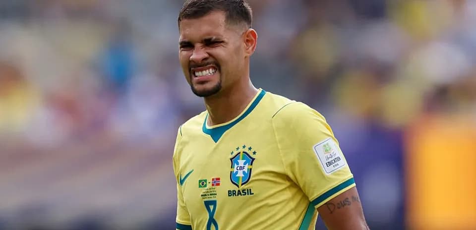 Brazilian player grimacing during match action