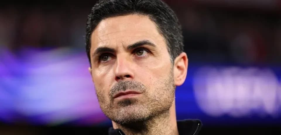 Coach observing from the sidelines during match