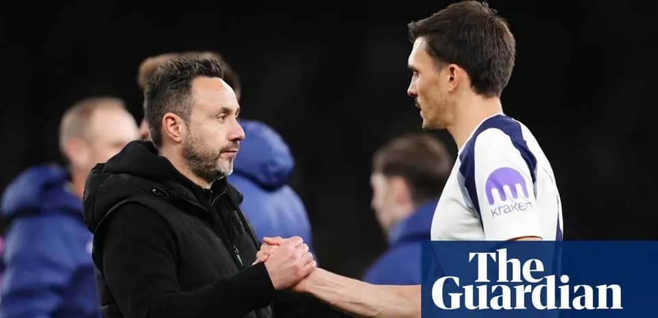 Two coaches shaking hands after a match
