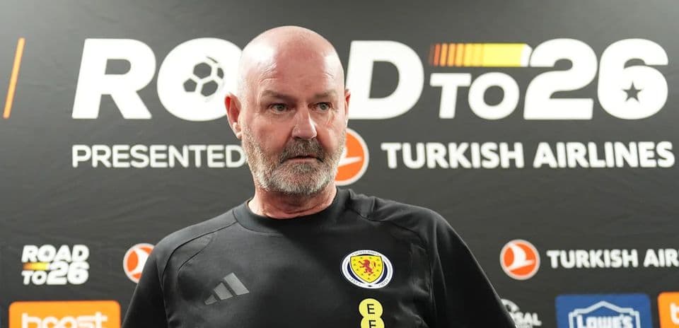 Scotland manager speaking at press conference backdrop