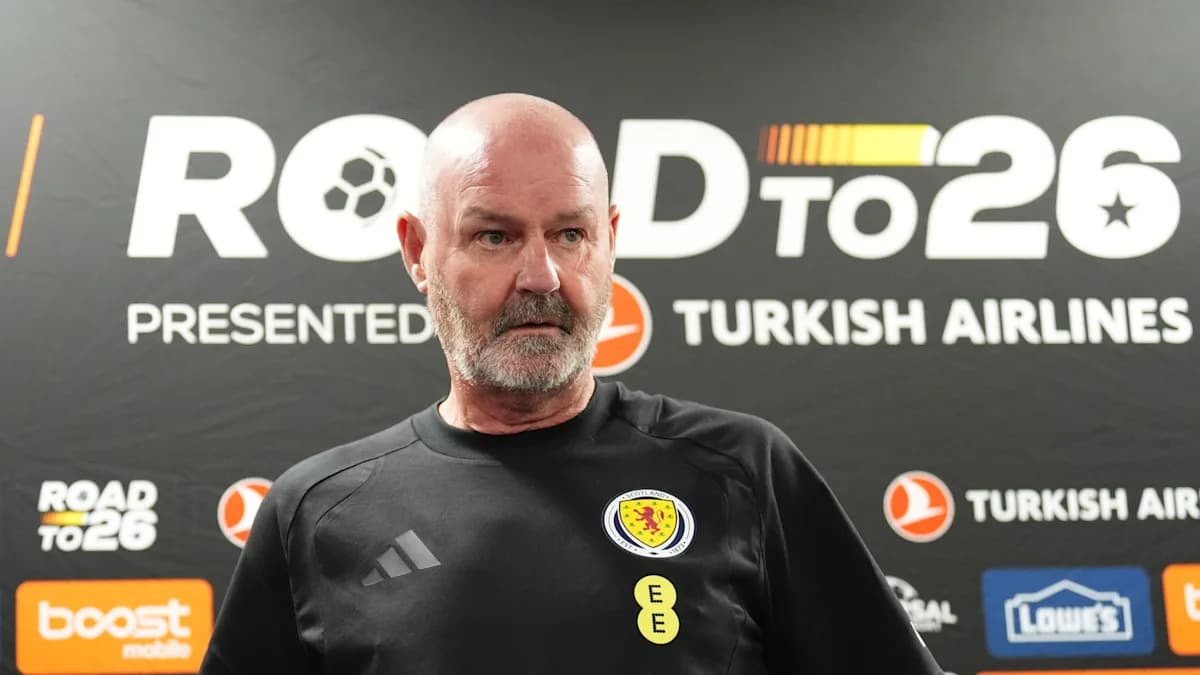Scotland manager speaking at press conference backdrop