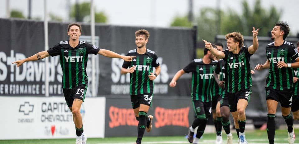 Austin II players celebrating a goal