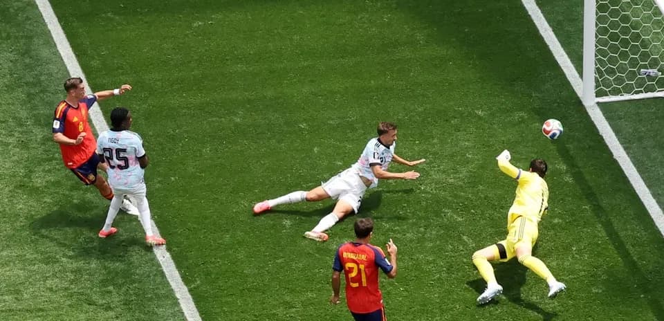 Goalkeeper diving to save shot during match