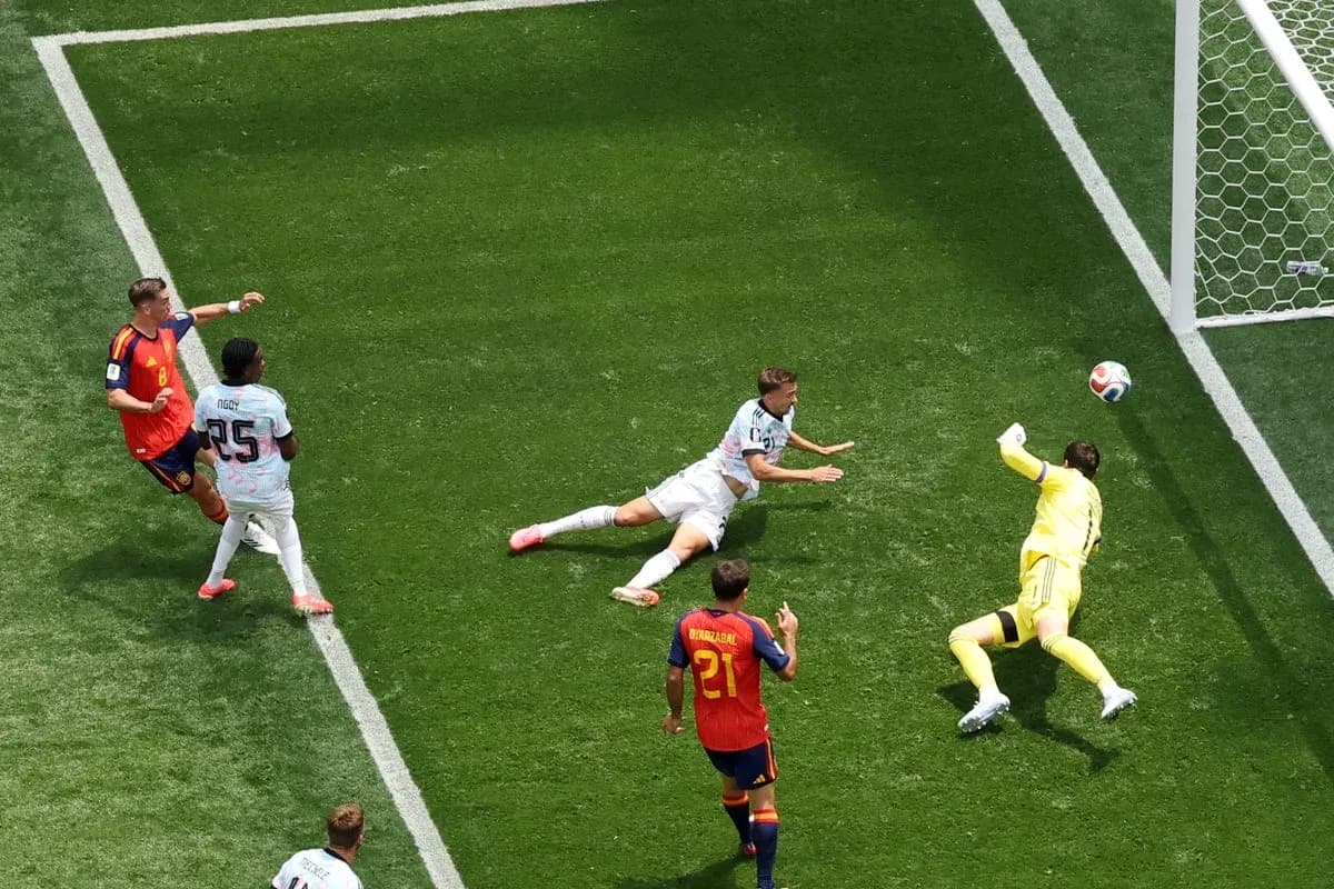 Goalkeeper diving to save shot during match