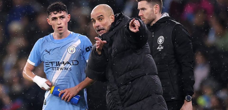 Pep Guardiola instructing player during match