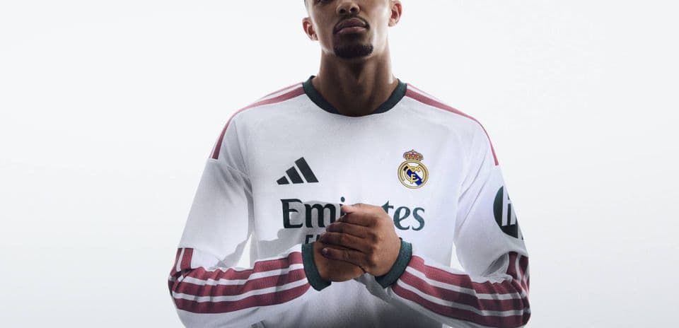 Player wearing Real Madrid jersey with crossed arms