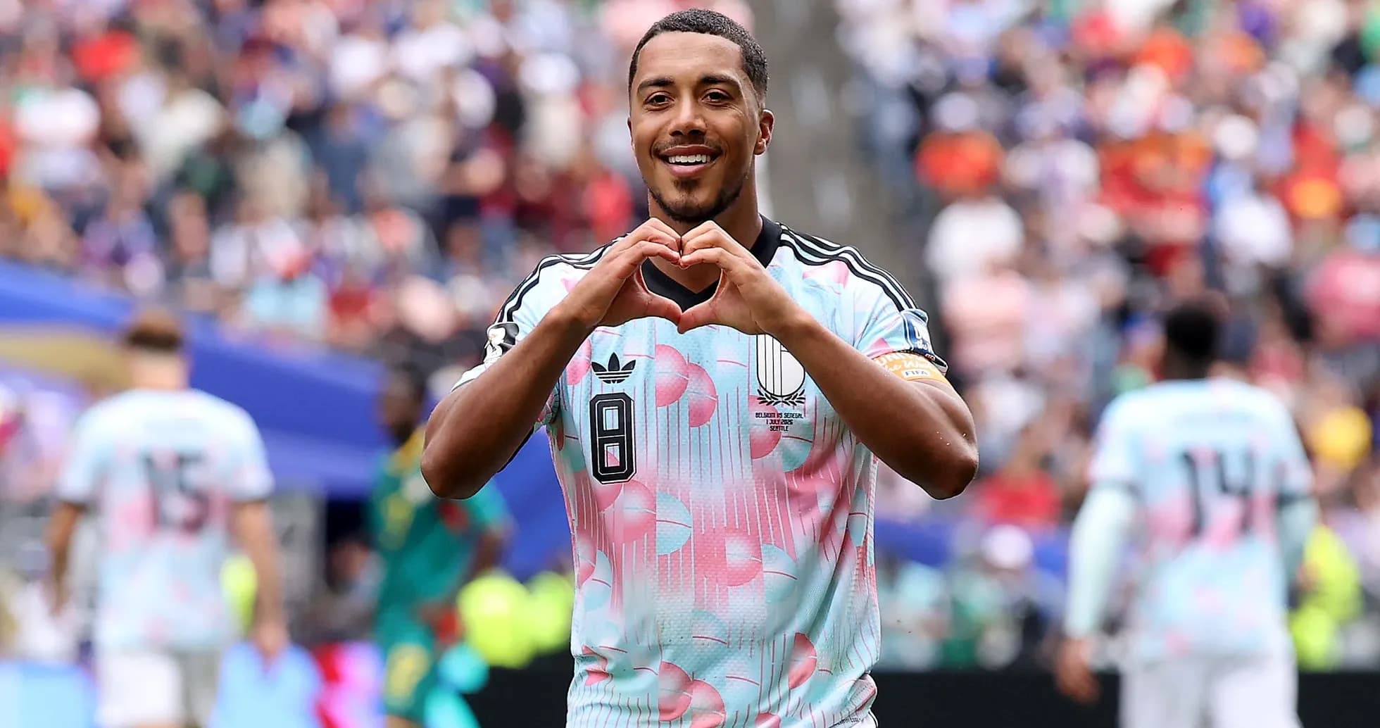 Player celebrating with heart gesture during match