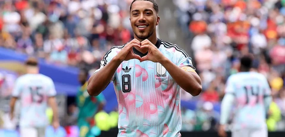 Player celebrating with heart gesture during match