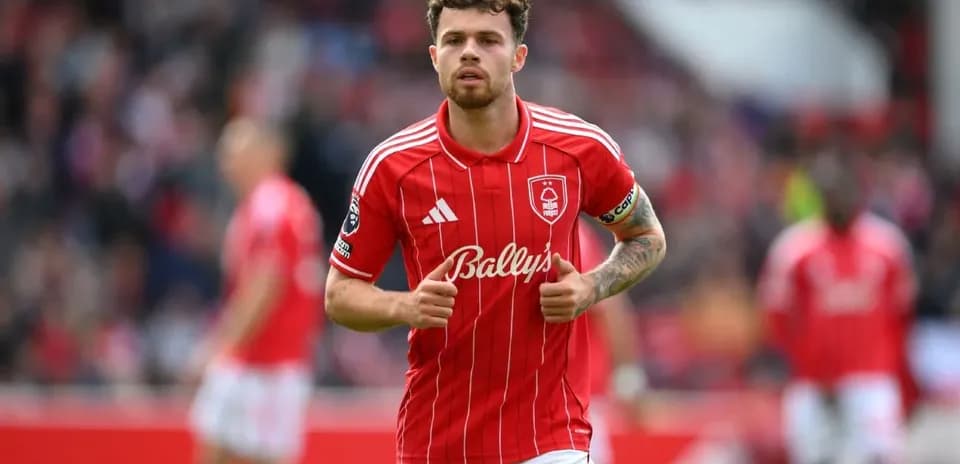 Player in red kit running during match