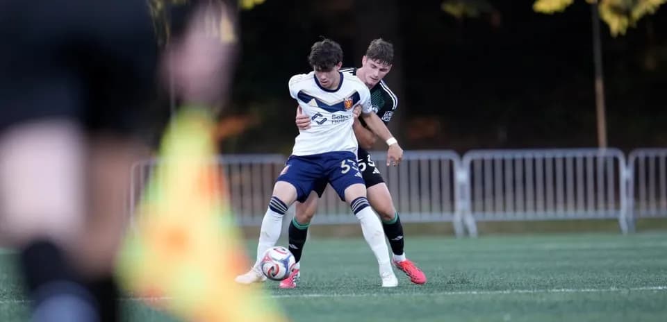 Real Monarchs player battling for the ball