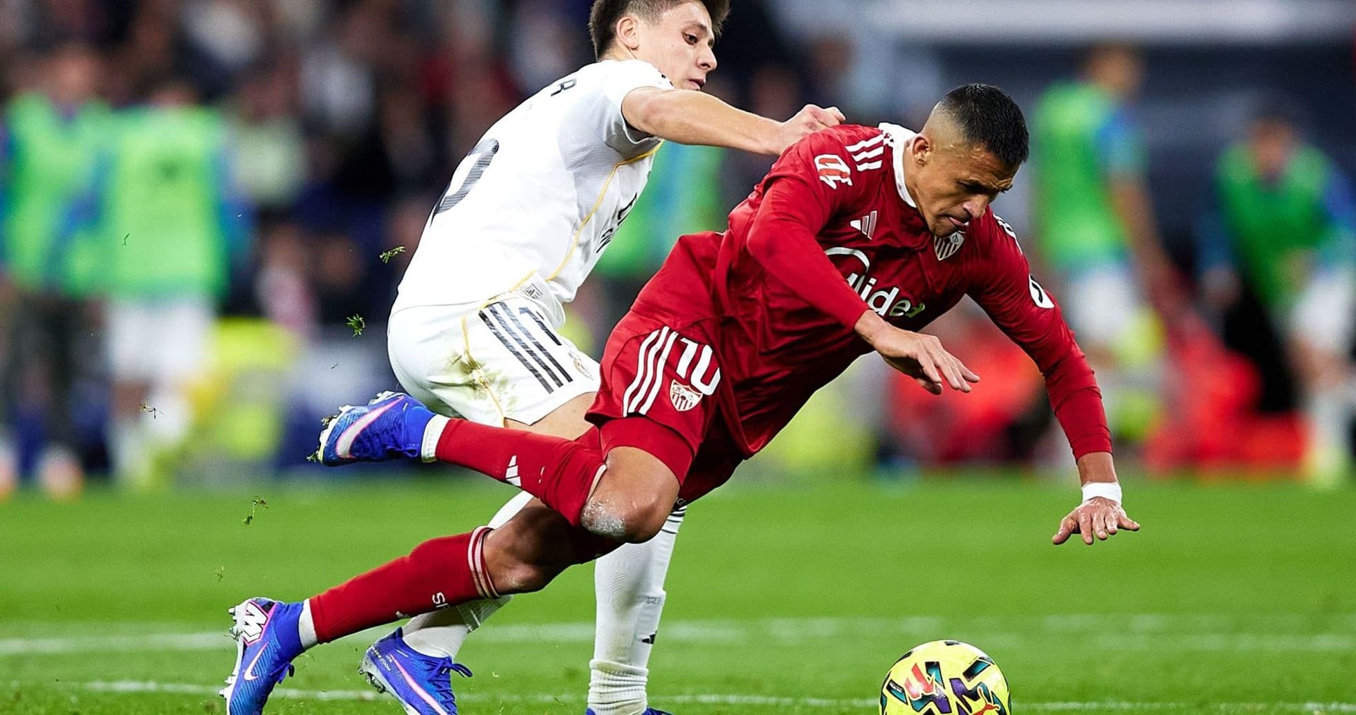 Sevilla player fouled by Real Madrid opponent