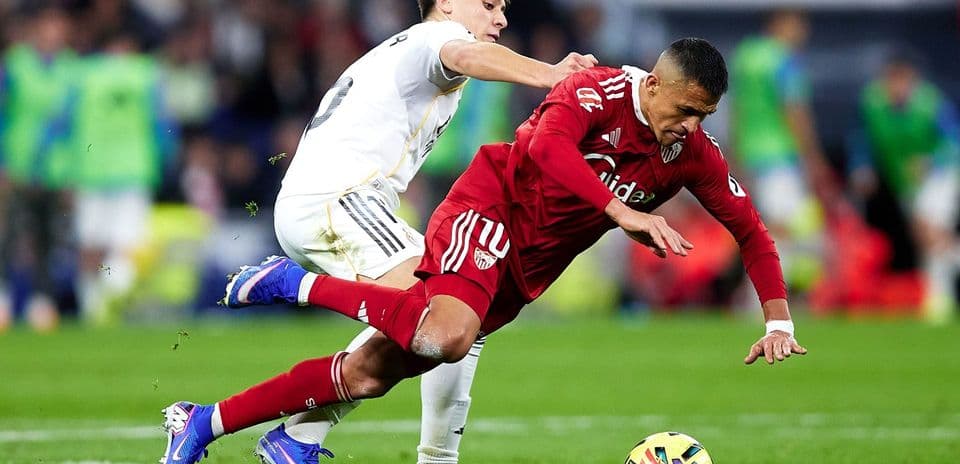 Sevilla player fouled by Real Madrid opponent