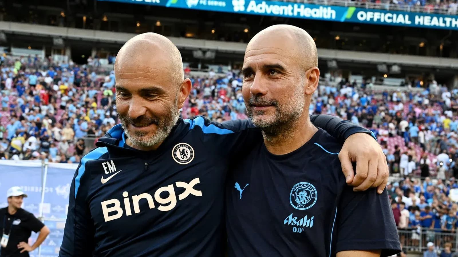 Two coaches celebrating after a match on the field